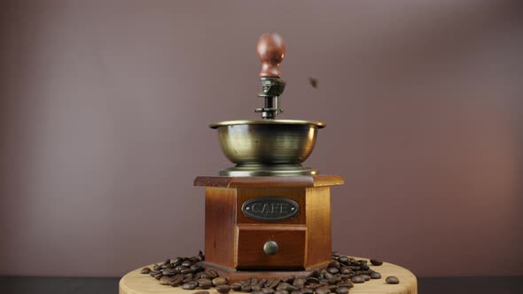 Coffee beans are falling into vintage coffee machine alt