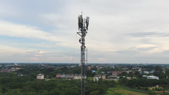 Zoom Out Telecommunication Antenna Tower With 5G And 4G Base Network. alt