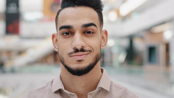 Confident Hispanic Mexican Indian Arabian Bearded Man Millennial 30s Male with Black Beard Looking alt