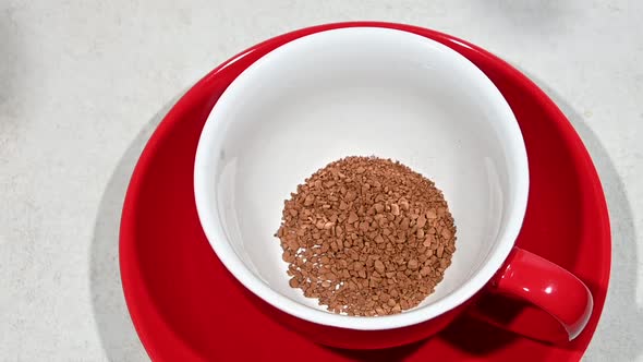 Pour instant freeze dried coffee crystals to cup alt