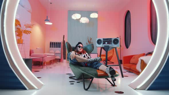 Awesome Lady in Stylish Outfit Posing in Vintage Studio with Cassette Player alt