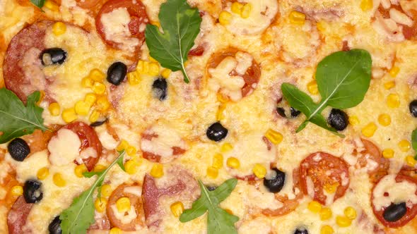 Pizza Close-up. Delivery of Products. Pizza with Cheese, Tomatoes and Olives