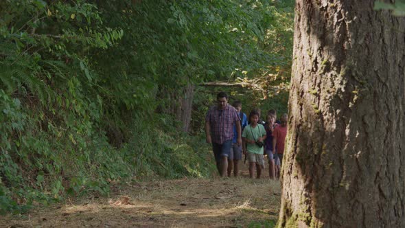 Kids at summer camp going on a nature hike