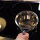 Mans Hand Puts and Twists a Saucepan on an Electric Stove Slow Motion - VideoHive Item for Sale