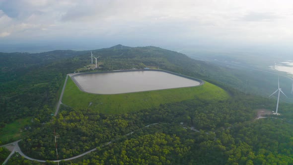 Aerial view of Lam Takhong Dam, Korat, Thailand. Reservoir dam and water in recycle energy alt