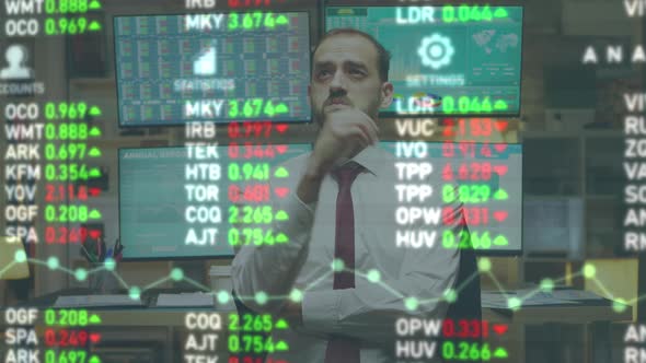 Stock Market Broker Looking at Augmented Reality Display with Numbers and Trades on It alt