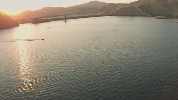 Aerial Drone Tracking Shot of a Wakeboarder on a  Lake During Sunset (Lake Kaweah, Visalia, CA)