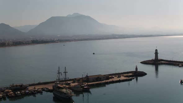 Sea Lighthouse Ships And Mountains Aerial View alt