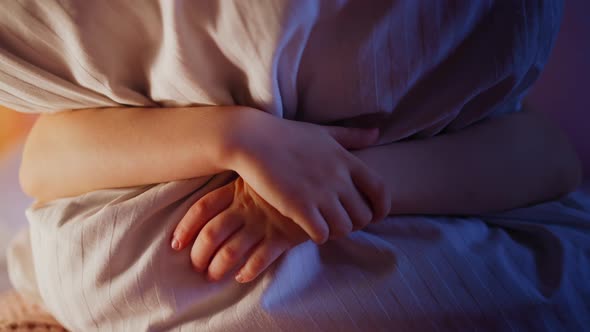 Little Kid Hugs Huge Soft Striped Pillow in Semidark Bedroom alt