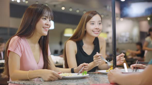 Asian young friend, beautiful woman and man having dinner enjoy eating food in restaurant together. alt