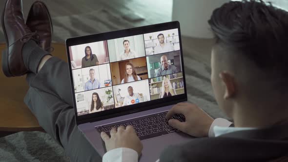 Asian man talking to multi ethnic group of business people working from home and office, talking alt