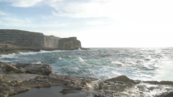Mediterranean Sea Crashing Waves in the Shore near Azure Window in Gozo Island alt