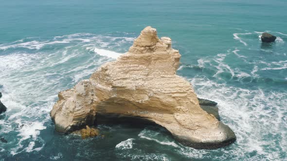 Aerial view of Catedral rocks in Paracas National Reserve in Peru 4K alt