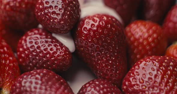Pouring Yogurt onto Strawberries in Slow Motion