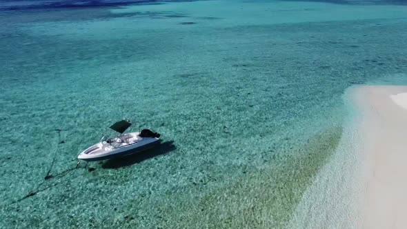 Aerial Drone Video of Boat Anchored in Tropical Exotic Island Bay with Crystal Clear Turquoise Sea