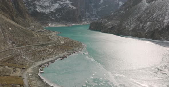 Zooming in aerial shot of stunning view of Attabad Lake, in Gojal Valley, Hunza, Gilgit Baltistan, P alt