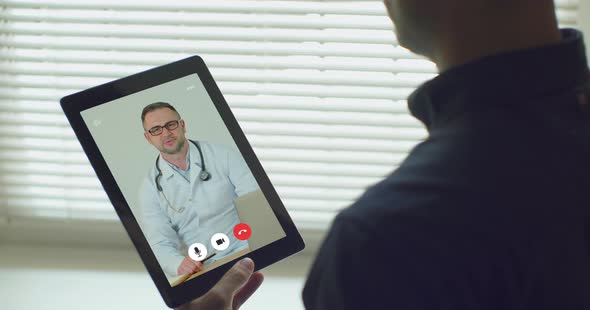 Male Using Online Chat To Talk with Family Therapist and Checks Possible Symptoms During Pandemic of alt