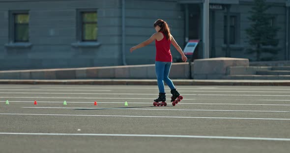 Rollerball Coaching a Girl Doing a Rotation on Roller Skates alt