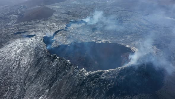 Otherworldly Aerial Drone View of Smoky Volcanic Lake Lava Landscape Drone Flying Backwards Reveals alt