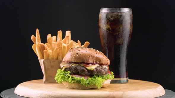 Tasty Burger With French Fries And Cold Coke