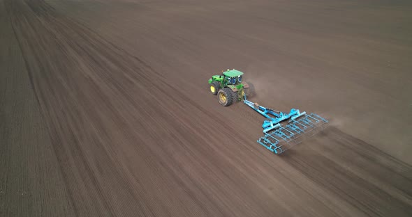 Tractor on Agricultural Field Aerial View alt