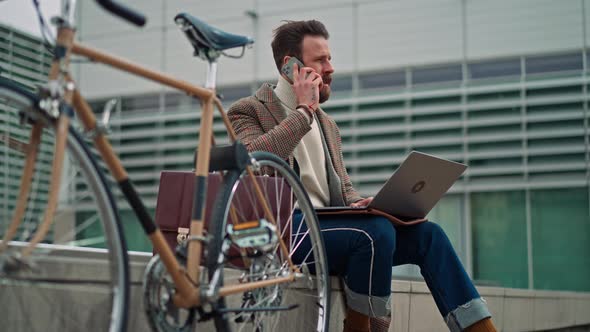 Contemplative Businessman Sitting Outside and Thinking About Solving Problem alt
