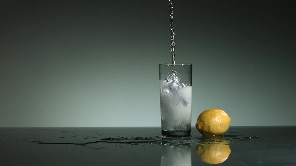 Carbonated liquid pouring into glass filled with ice - ultra slow mo 1500fps - LIQUID POUR  alt