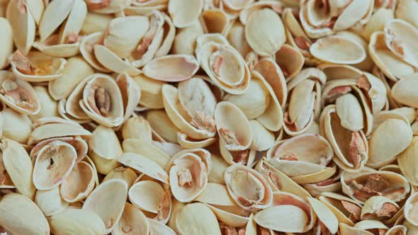Looped Rotating Empty Pistachios Shells Full Frame Closeup Background