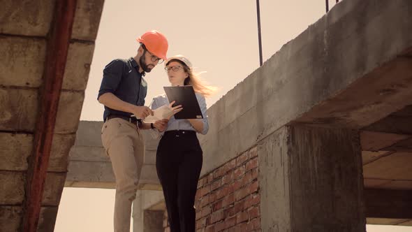 Real Estate Building Project Architect. Builder Constructor Read Blueprints. Inspecting Building. alt