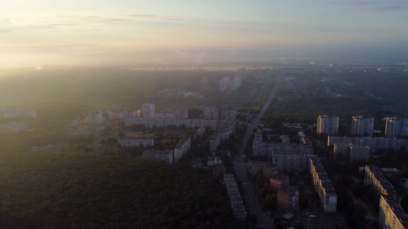 Sunrise in city with epic clouds, fog, sun shine