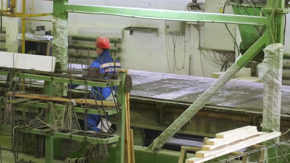 Worker going through workshop