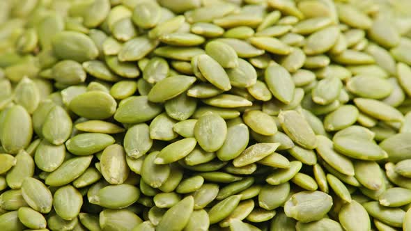Peeled Pumpkin Seeds Fullframe Spinning Background alt