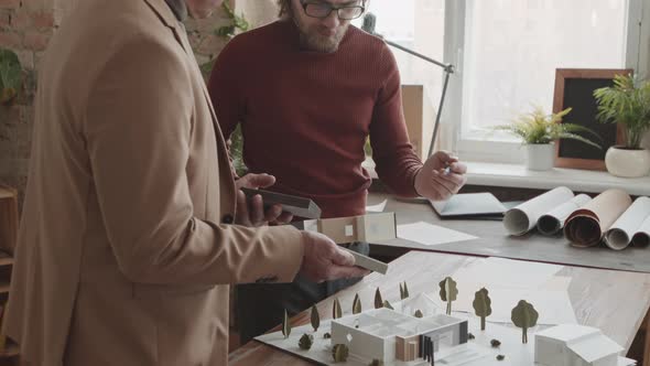 Male Architects Creating 3D Layout Of New House In Office alt