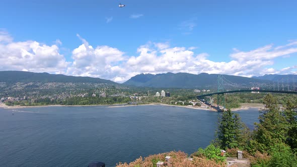 Panoramic view of Lions Gate Bridge from Stanley Park in Vancouver, BC Canada; a suspension bridge t alt