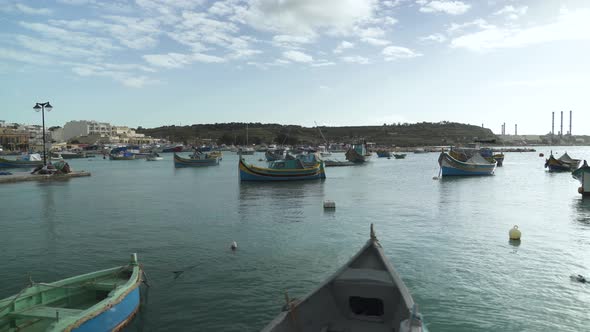 Marsaxlokk Bay with Traditional Fishing Boats Decorated with Osiris Eyes in the Harbour