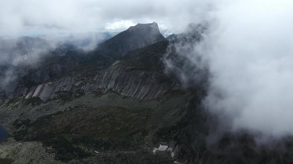 Huge Stones Boulders and Rocks Shrouded in Low Clouds Ergaki Natural Park alt