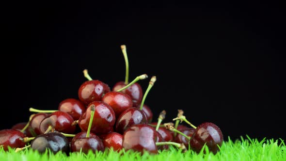 Group of cherries isolated on a dark background