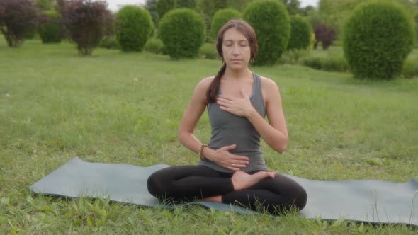 Slow Motion of a Woman Deep Breathing Cross Legged Sitting Posture Yoga Breathing