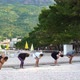 Group of People doing yoga Asanas on Beautiful Seaside - VideoHive Item for Sale