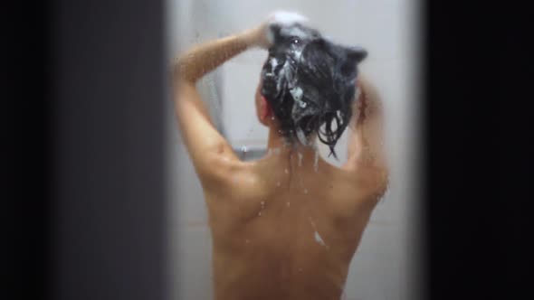 Woman Washing Her Hair with Shampoo