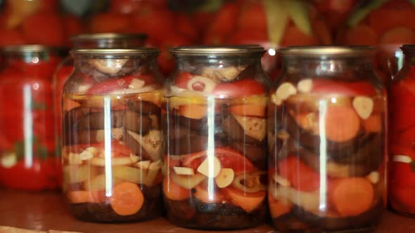 Jars With Pickled Vegetables On Wooden Shelf