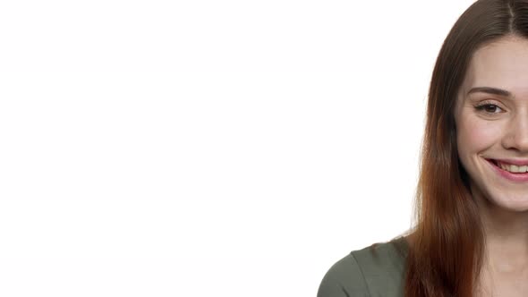 Half Side Portrait of Young Pretty Woman 20s Ooking on Camera and Smiling Near Copyspace Isolated alt