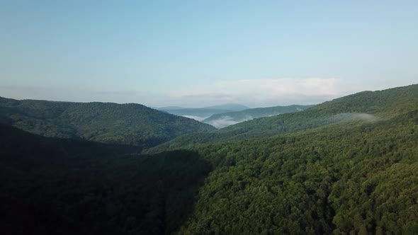 Aerial Landscape View of Caucasus Mountain at Sunny Morning with Fog alt