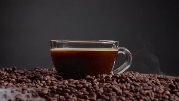 Filled Espresso Cup Standing Roasted Coffee Beans Close Up alt