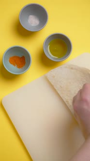 Vertical Tabletop Video Chef Cookes Mexican Food Man Slices Corn Tortilla to the Small Nachos