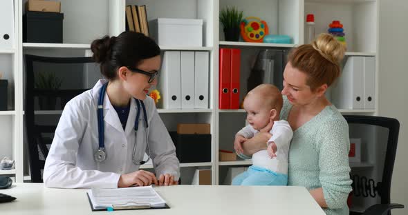 Pediatrician Inviting Mother and Child To Office