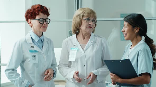 Portrait of Team of Multiethnic Female Doctors in Clinic alt