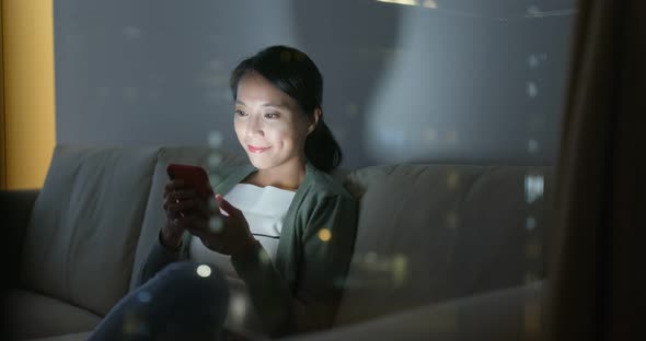 Woman Use of Mobile Phone at Home alt