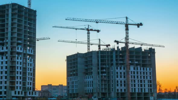 Time Lapse Footage of a Big Construction Site with Several Working Cranes alt