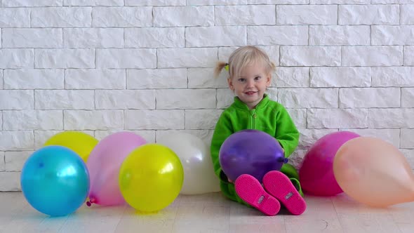 Child with Baloons